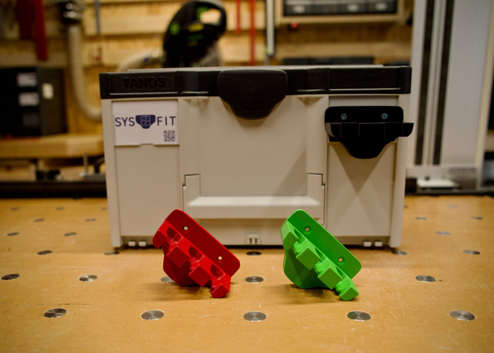 MRC Rack holding three rail clamps at the bench edge.