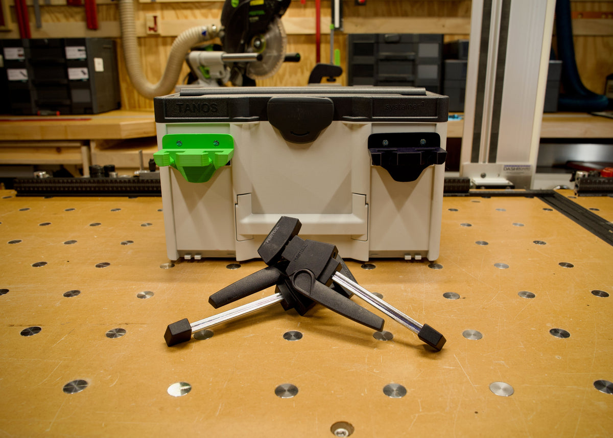 FCE Rack holding two Festool Clamping Elements at the bench side.