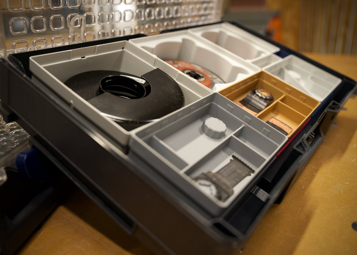 Oscillating Multi-Tool Blade Bins — five Starlock-matched colors for instant blade identification.