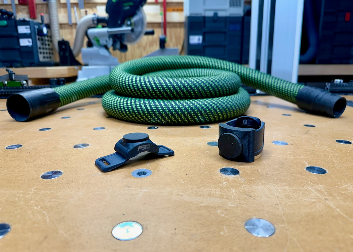 Magnetic Hose Dock holding an extractor hose end against a steel surface.