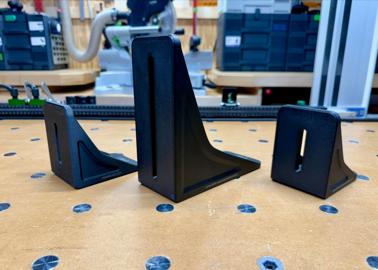 BenchGrip pod mounted on a bracket for vertical edge hold-down.