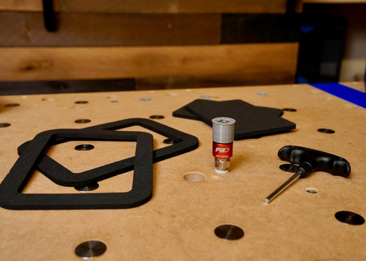 AnchorPod installed in an MFT bench — surface clear, workpiece held under vacuum.